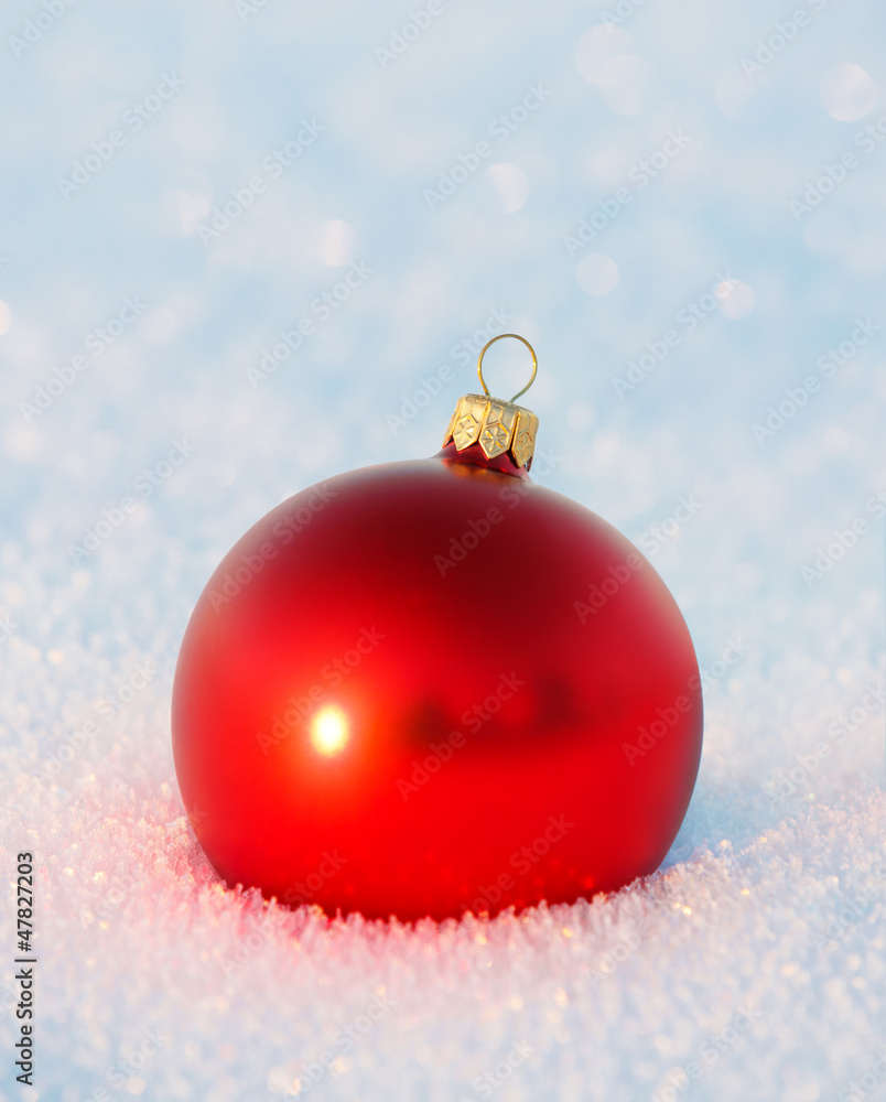 Red Christmas toy in the snow