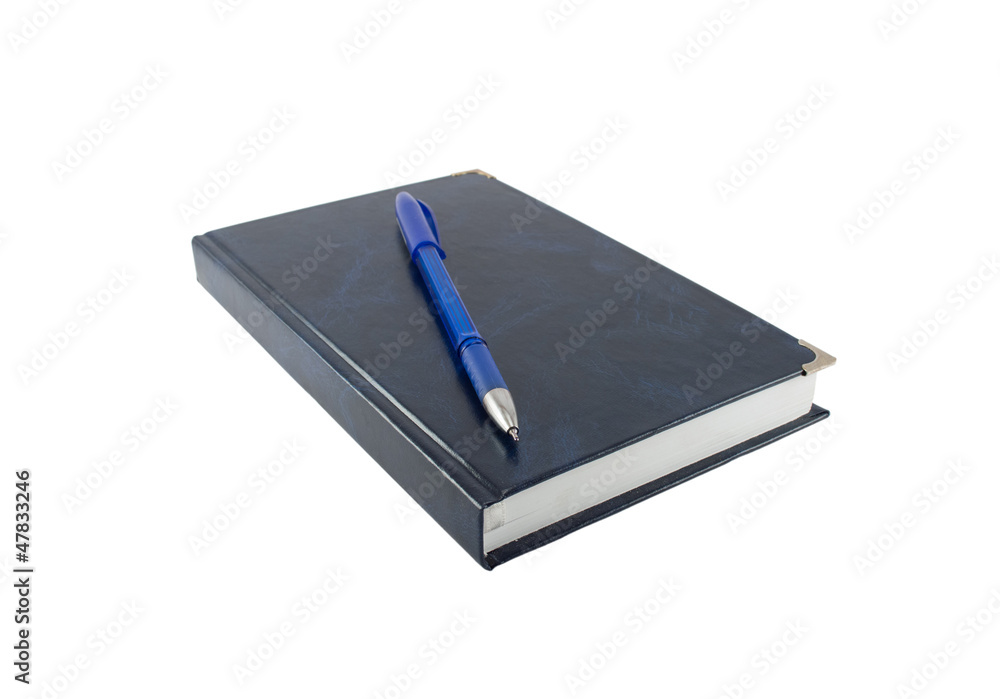 The pen lying on a notebook The pen lying on a notebook
