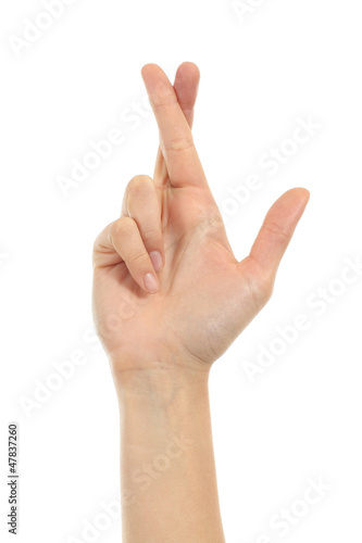 Woman hand crossing fingers