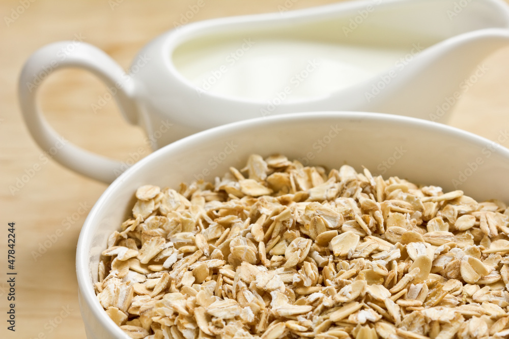 Oat flakes in bowl  and milk