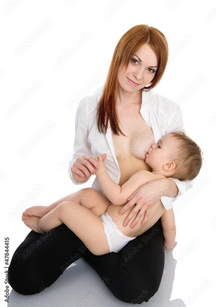 beautiful mother breast feeding her infant, isolated on white