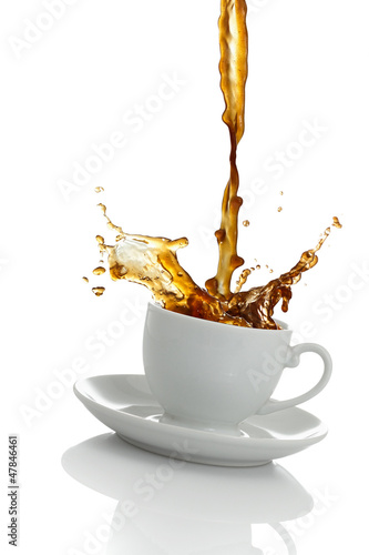 Coffee spilling out of a cup