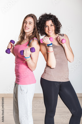 Two Women with Light Weights at Gym