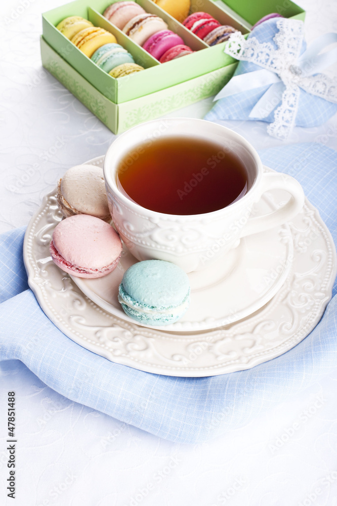 Cup of tea with colorful french macarons Cup of tea with colorful french macarons