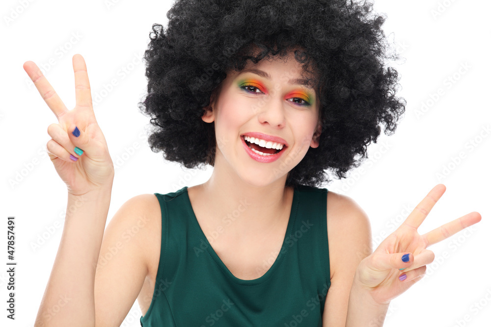 Woman with afro showing peace sign Woman with afro showing peace sign