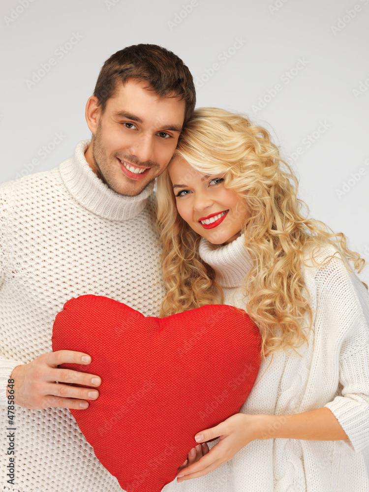 family couple in a sweaters with heart