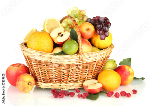 Assortment of exotic fruits in basket  isolated on white