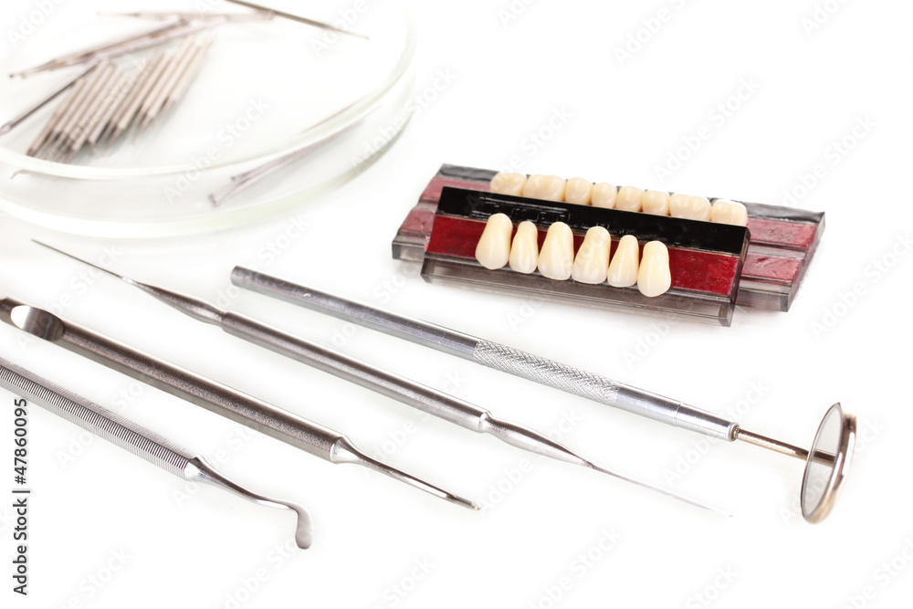 denture with dental tools isolated on white denture with dental tools isolated on white