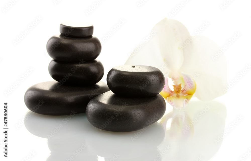 Spa stones and orchid flower, isolated on white. Spa stones and orchid flower, isolated on white.