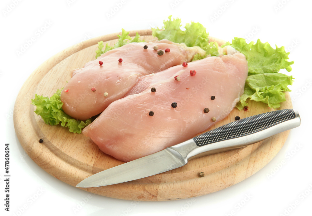 raw chicken meat on cutting board, isolated on white