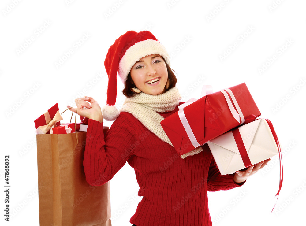 Happy girl in santa hat with bag full of gifts Happy girl in santa hat with bag full of gifts