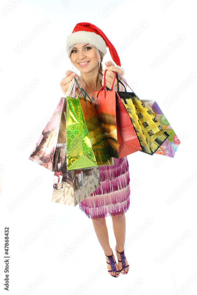 The girl holding a variety of packages and extends upward gifts