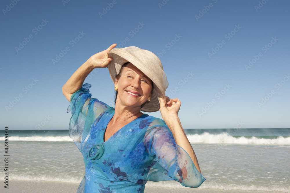 Portrait happy mature woman isolated sky