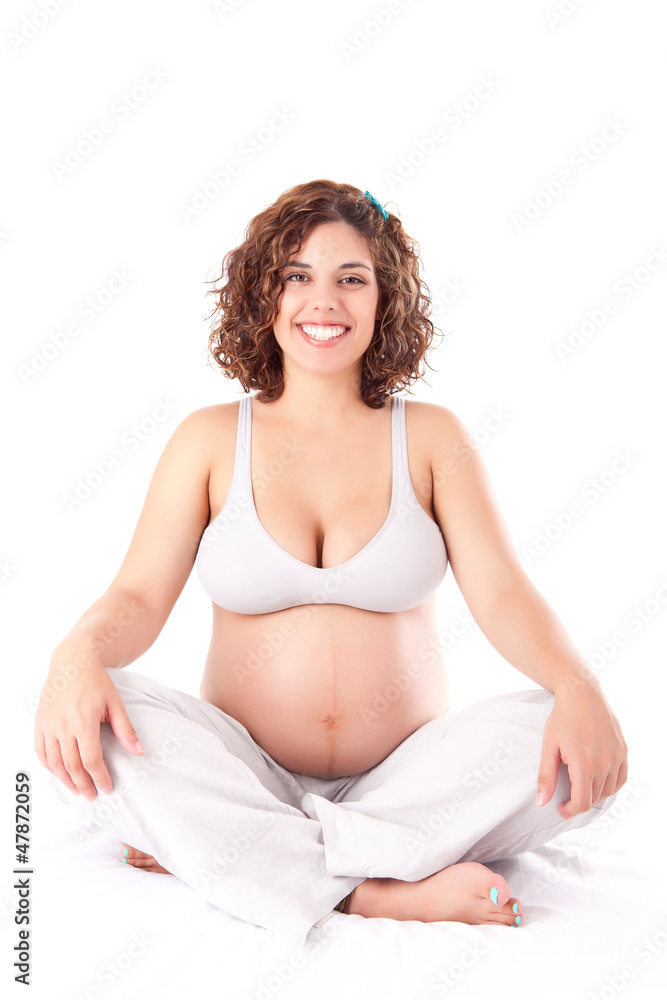 Beautiful pregnant woman showing her good shape