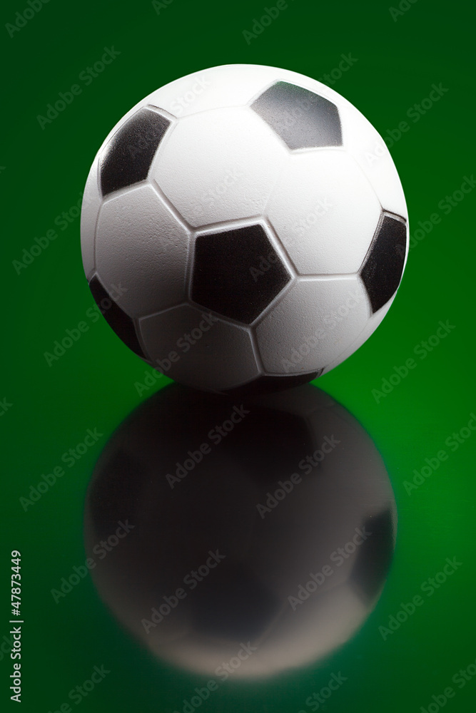 Soccer ball on green background