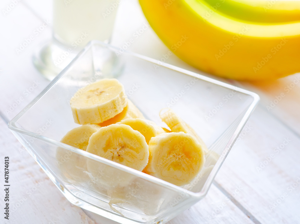 Fresh banana in the glass bowl, banana and milk Fresh banana in the glass bowl, banana and milk