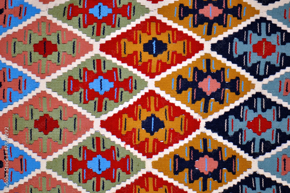 Segment of handmade carpets in bright colors Segment of handmade carpets in bright colors