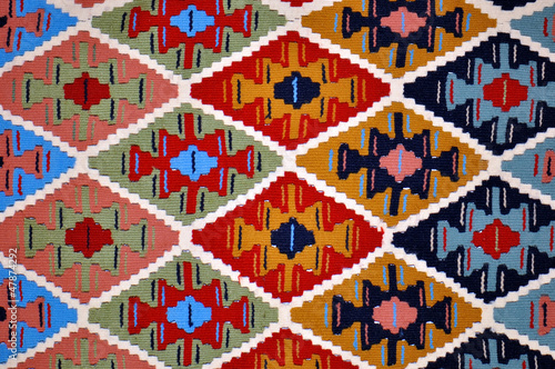 Segment of handmade carpets in bright colors