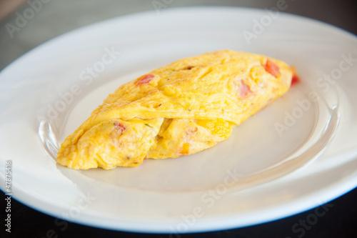Omelete egg on white dish
