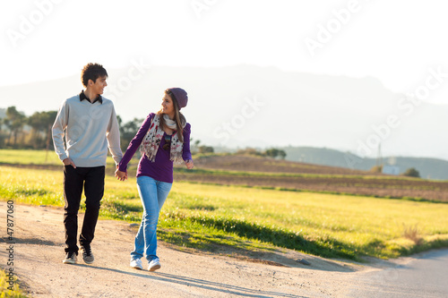 Young couple having a walk in countryside.