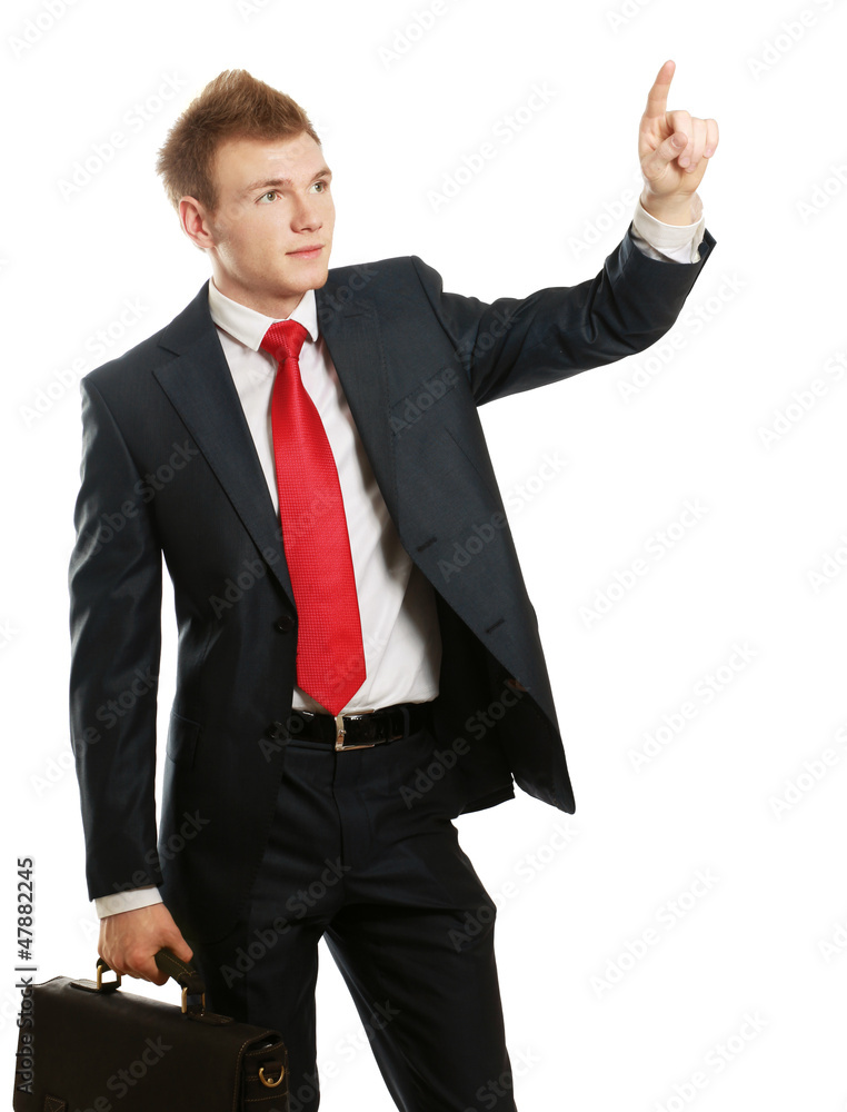 A young man pointing something isolated on white background A young man pointing something isolated on white background