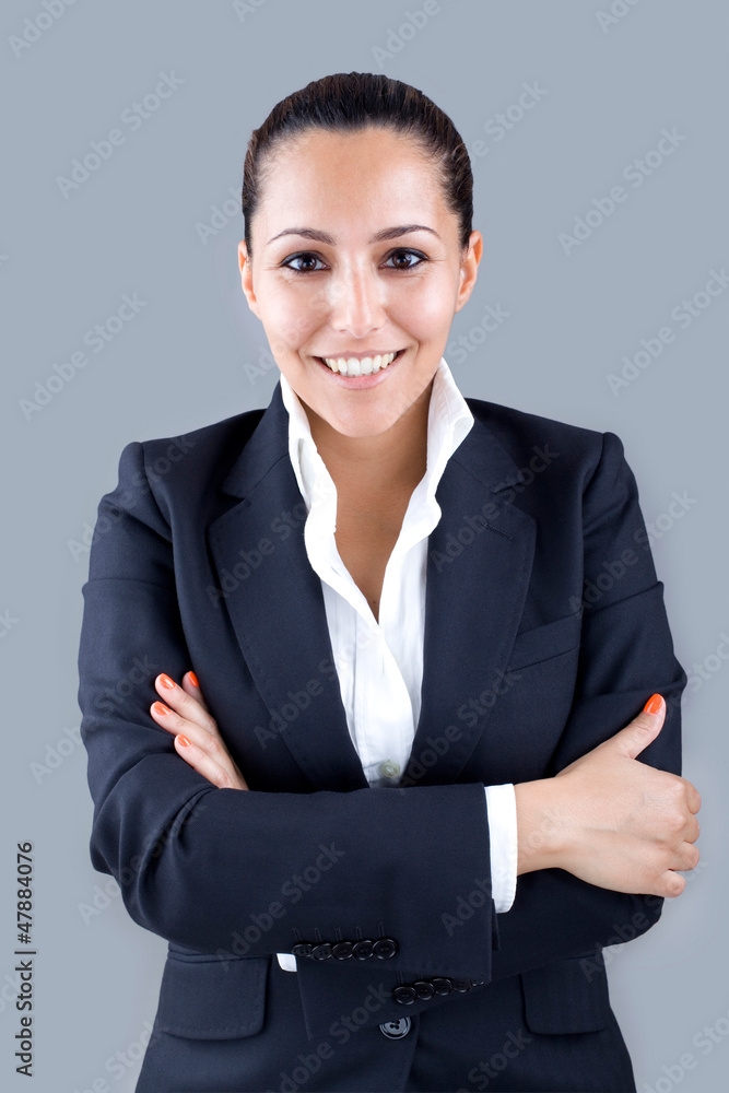 Portrait of a smiling beautiful young business woman standing ag Portrait of a smiling beautiful young business woman standing ag
