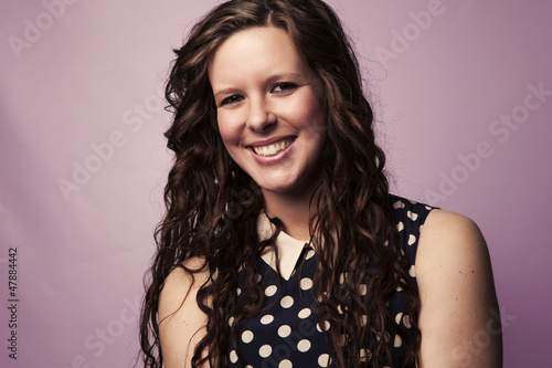 Young Woman in Polka Dots Smiles