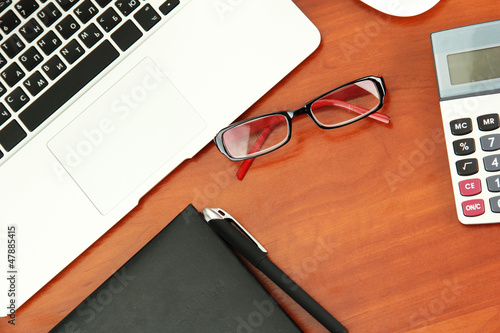 office supply and laptop isolated on white