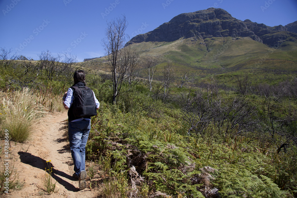 A man walikng up a mountain