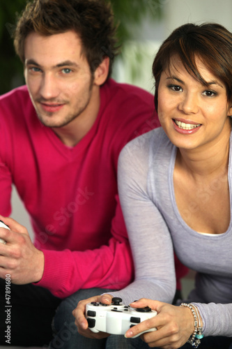 young duo playing video games photo