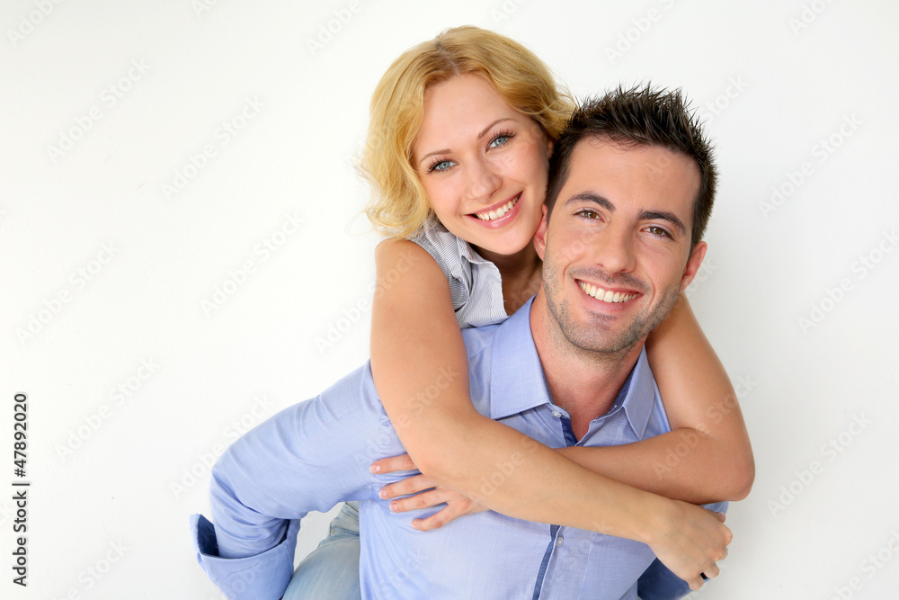 Man carrying girlfriend on his back Man carrying girlfriend on his back