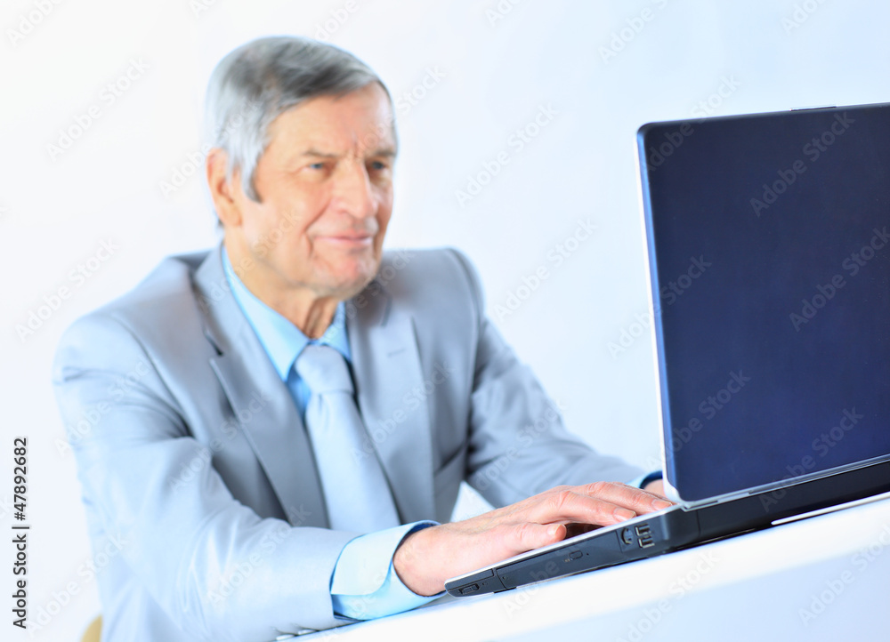 The businessman at the age of works for the laptop. The businessman at the age of works for the laptop.