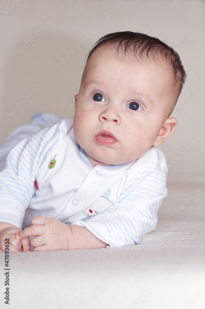 The thoughtful baby lies on a stomach (3 months) The thoughtful baby lies on a stomach (3 months)