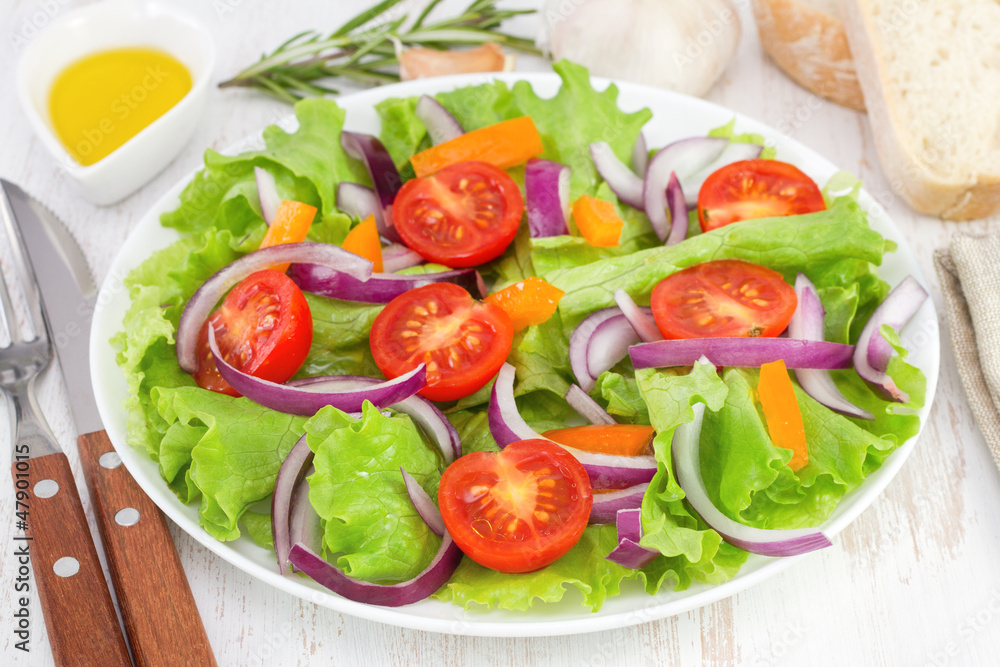 fresh salad on the white plate with bread and oil fresh salad on the white plate with bread and oil
