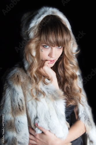 Fototapeta Naklejka Na Ścianę i Meble -  young beautiful woman with long hairs in fur coat