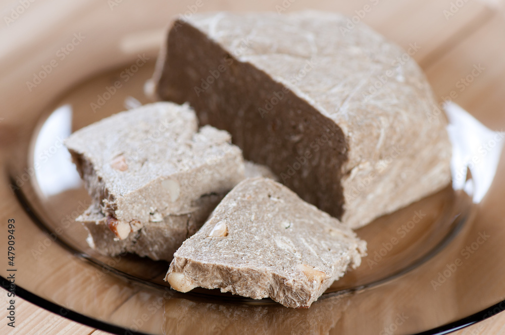 Glass plate with sunflower halva, horizontal shot Glass plate with sunflower halva, horizontal shot