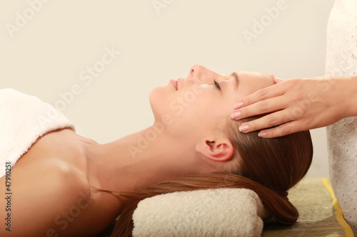 An attractive young woman receiving massage