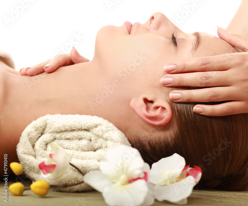 An attractive young woman receiving massage