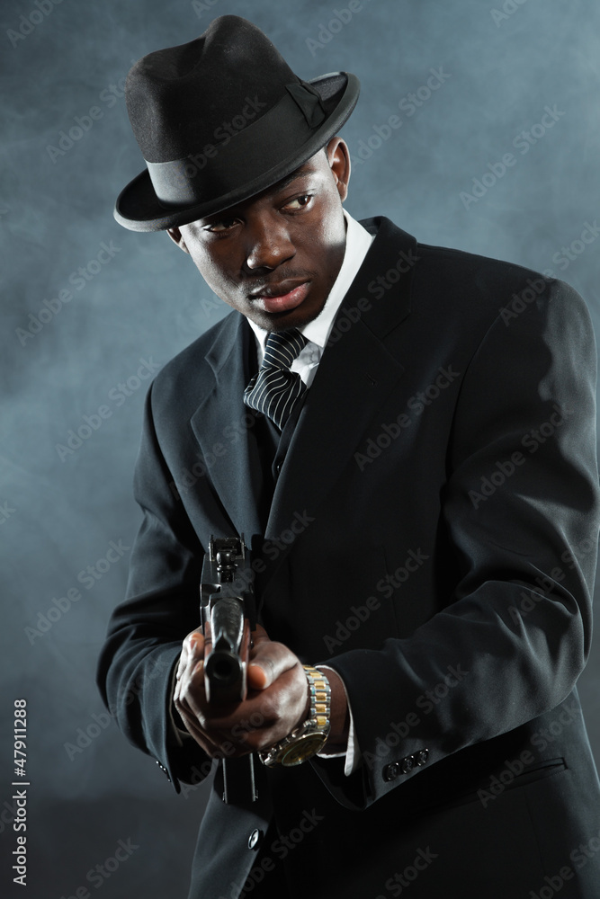 Black american mafia gangster man in suit with gun. Stock Photo | Adobe ...