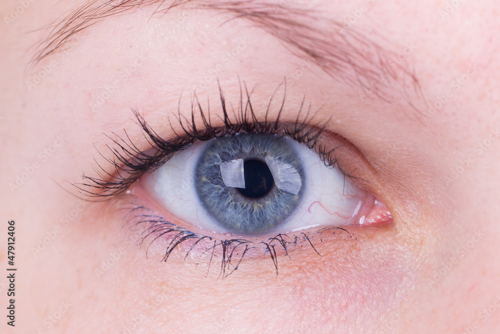 Fototapeta premium Close up of inserting a contact lens