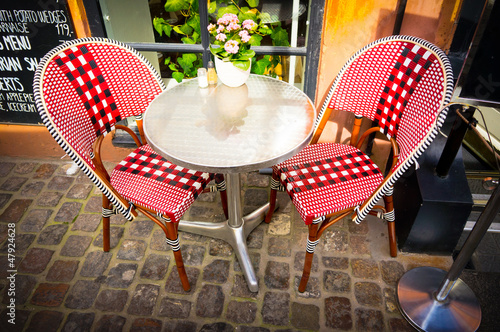 Vintage old fashioned cafe chairs with table in Copenhagen, Denm photo