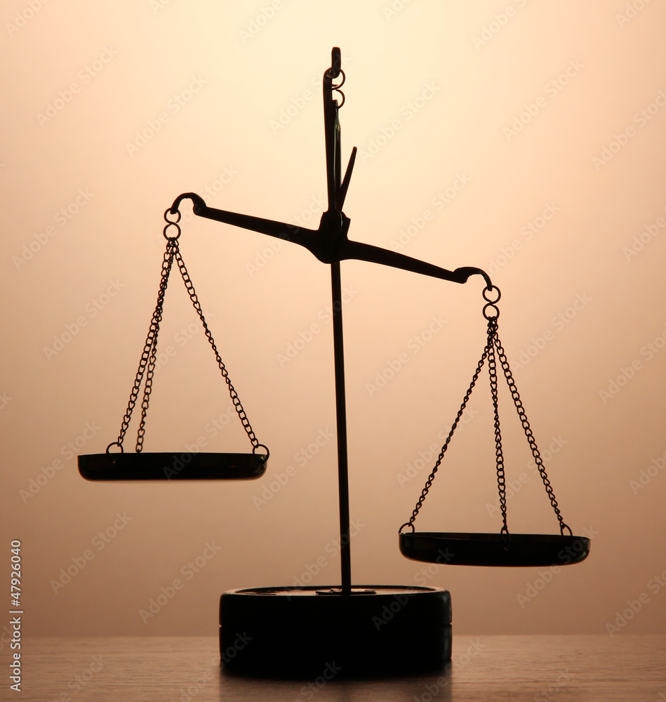 Gold scales of justice on brown background Stock Photo | Adobe Stock