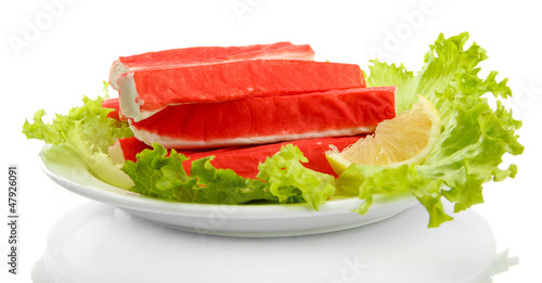 Crab sticks with lettuce leaves and lemon