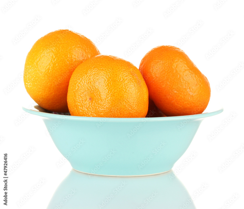 Tasty mandarines in color bowl isolated on white Tasty mandarines in color bowl isolated on white