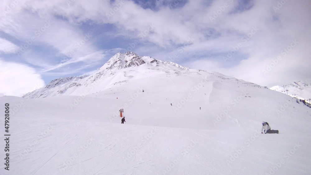 Tourists go on skis on mountain Tiefenbach downwards Tourists go on skis on mountain Tiefenbach downwards