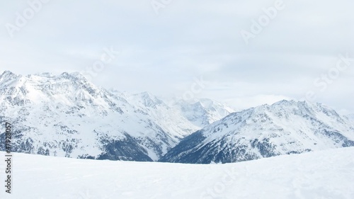 Wallpaper Mural Group of tourists moves down on ski line against mountain tops Torontodigital.ca