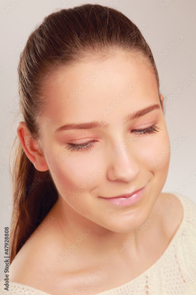 A portrait of young woman on white background A portrait of young woman on white background