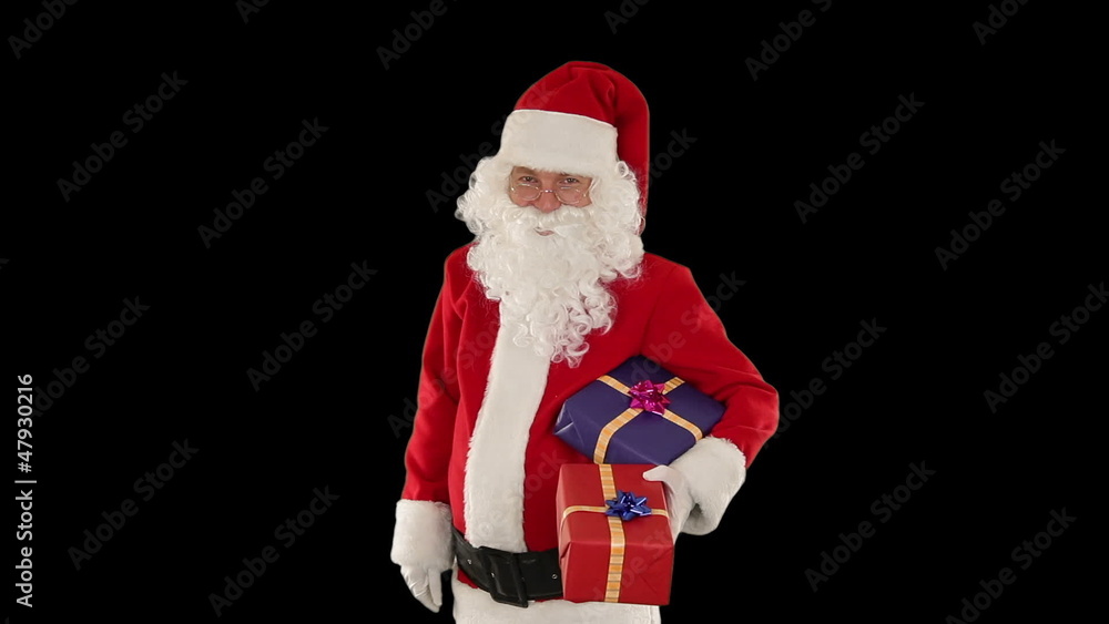 Santa Claus holding presents, against black Santa Claus holding presents, against black