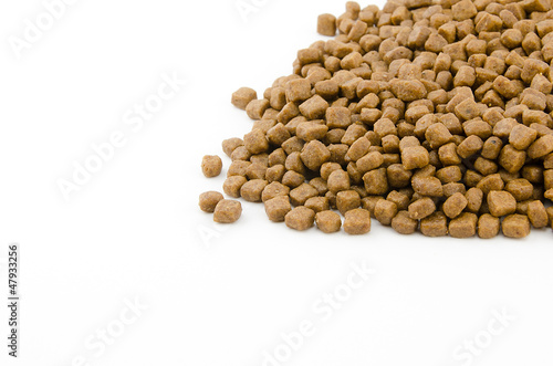 dry cat food on white background