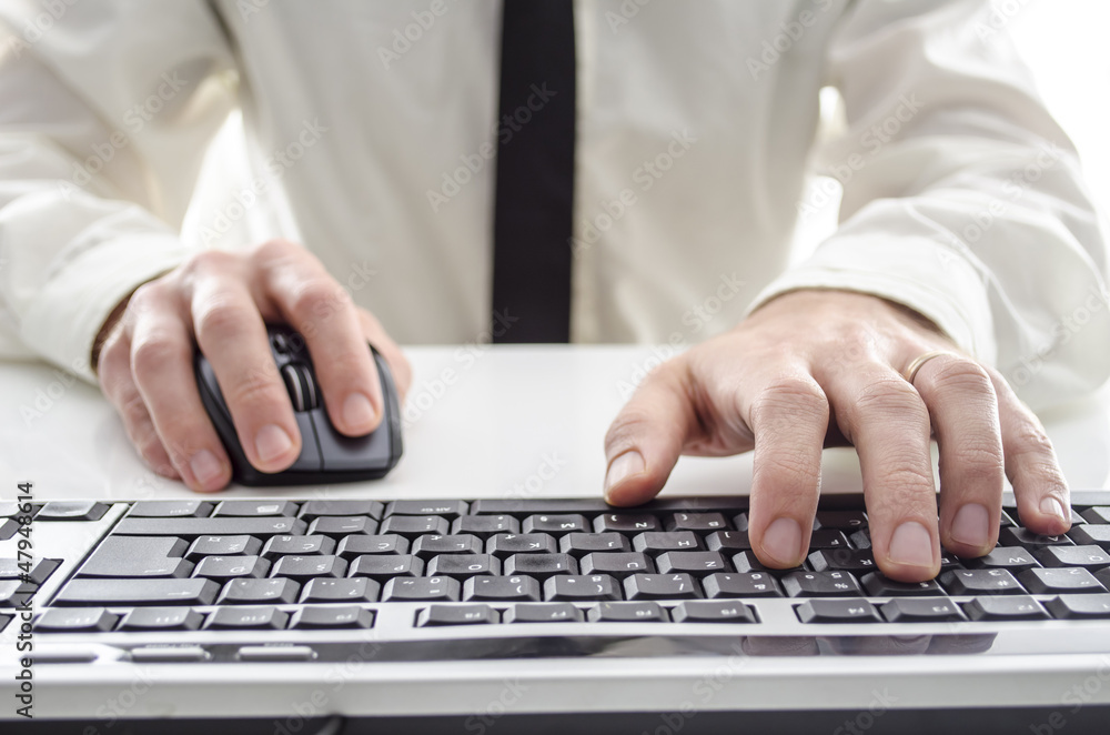 Man using a computer Man using a computer